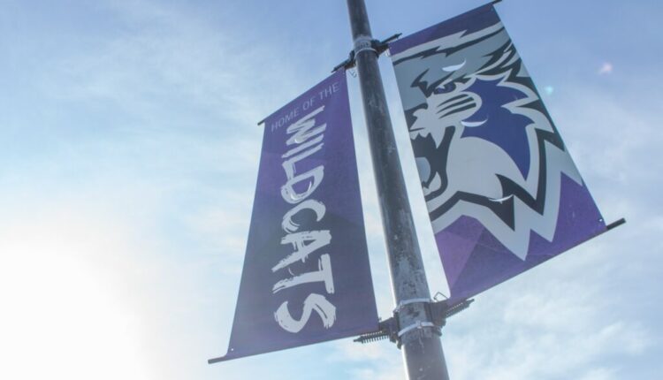 One of Weber State University's many wildcat banners glows in the morning sun.  (Kennedy Robins / The Guide)