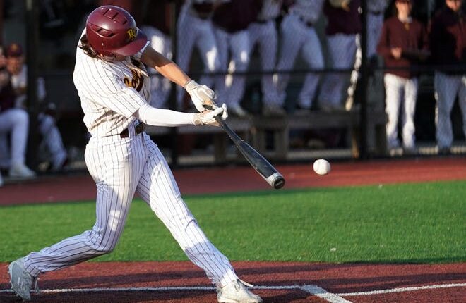 Bloomington North's Jackson Roberts (7) hits the ball during the game against Terre Haute North at North Tuesday evening.