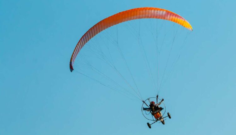 A photo of powered paraglider flying. Powered paragliding, paramotor and flying ultralight aircraft or any similarly-sized aircraft are now banned within most of the Glen Powell Dam Recreation Area, park officials said Thursday.