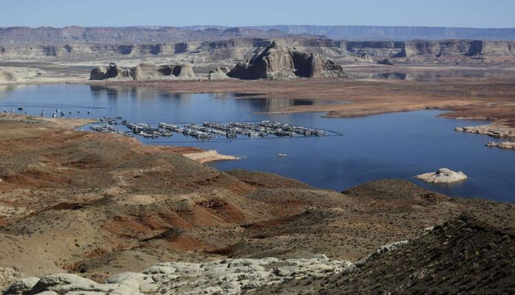 Lake Powell's Wahweap Marina is pictured in Wahweap, Ariz., on March 28, 2021. Campfires in approved areas are allowed in the Glen Canyon Powell Recreation Area and Rainbow Bridge National Monument, park officials said Friday.