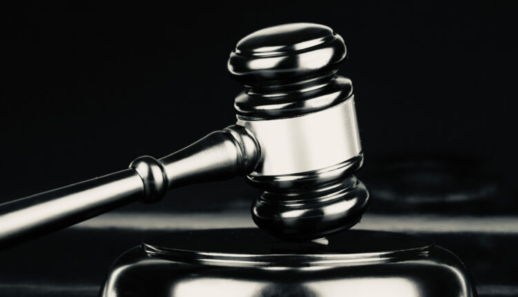 A black and white photo of a gavel.